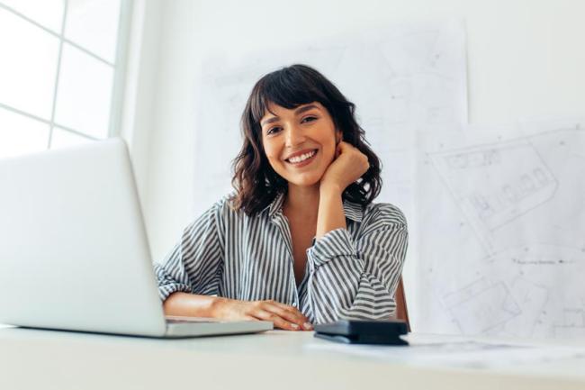 Smiling woman with a laptop
