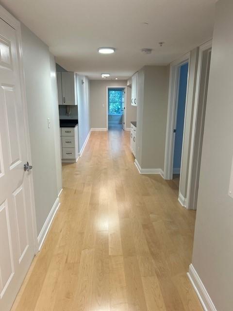 hallway with recessed lighting and wood flooring