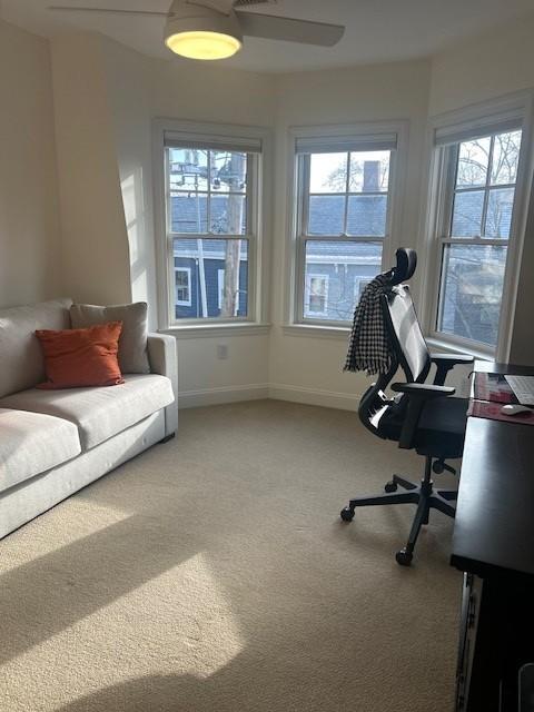Second bedroom with carpeted flooring and bay windows