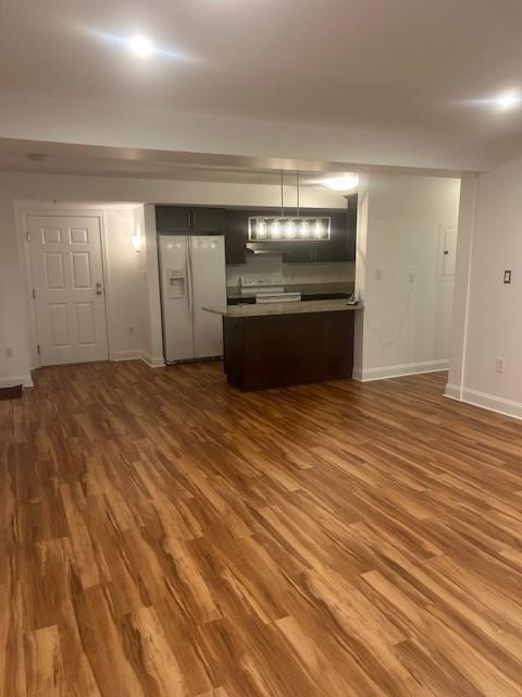 combined living and dining area with hard flooring and overhead lighting