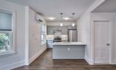 A sample kitchen in 5 Sacramento with hard floors, stainless steel appliances, kithen island, recessed lighting and pendant lights