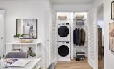 The stacked washer and dryer included in the laundry closet