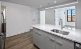 1 bedroom convertible floorplan facing kitchen island and living areas